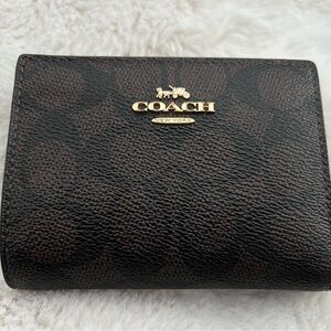 Coach signature brown/black Leather bifold Zip Card Case with Gold Hardware